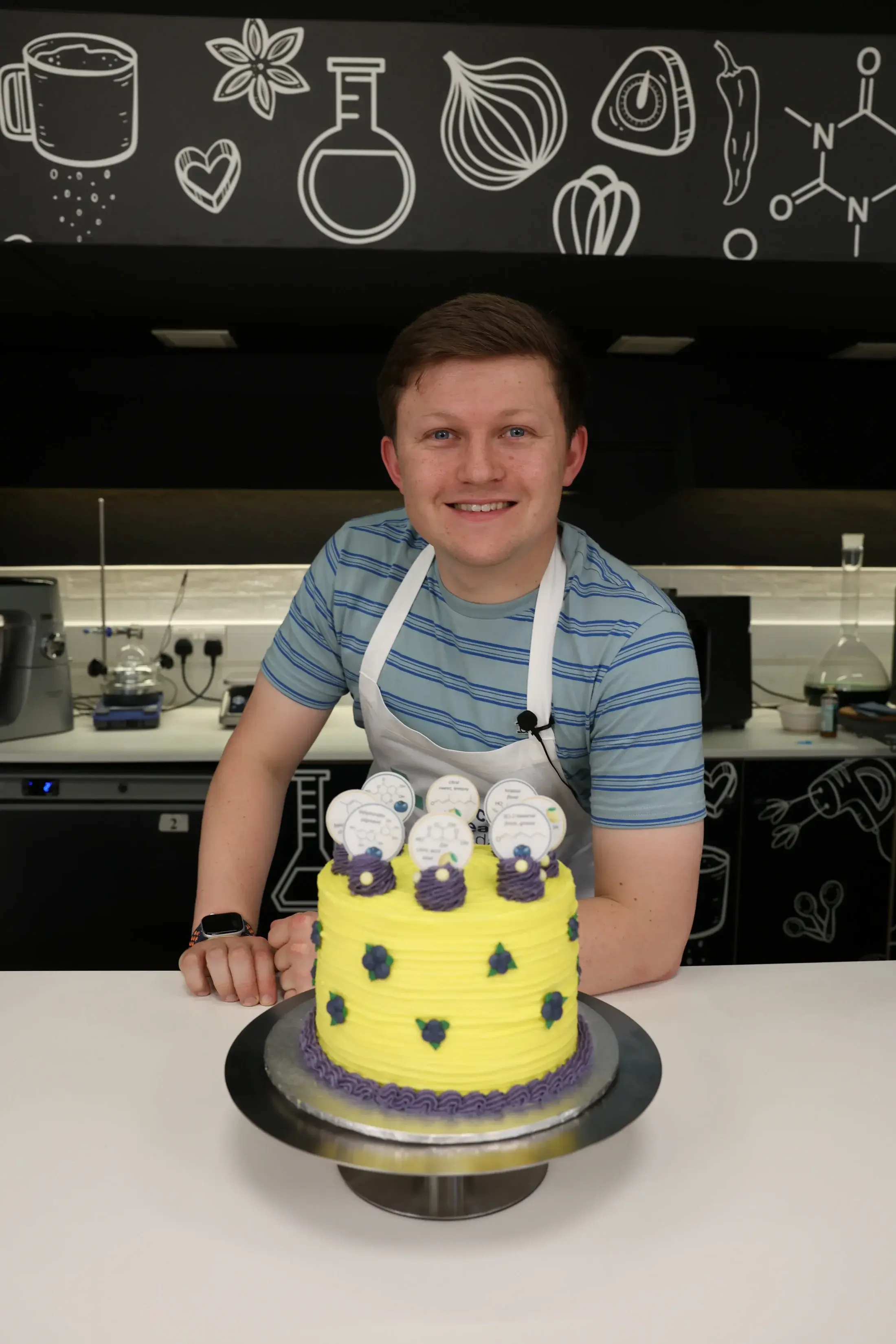 Josh Smalley with his science-themed lemon and blueberry cake