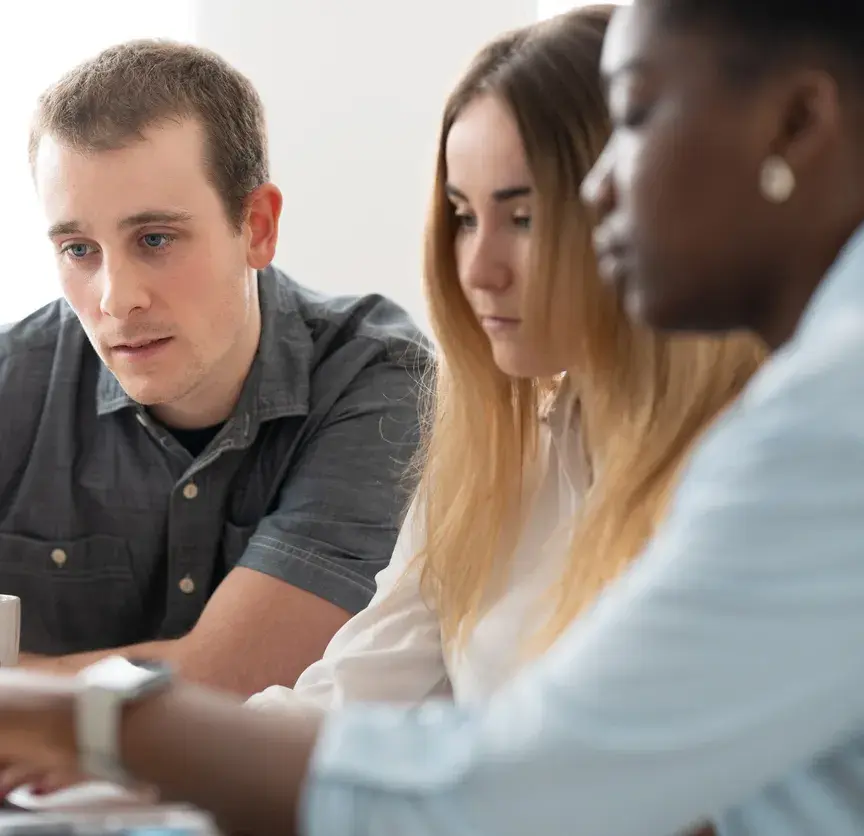 Multiethnic coworkers concentrated on laptop 1471838263 1258x838